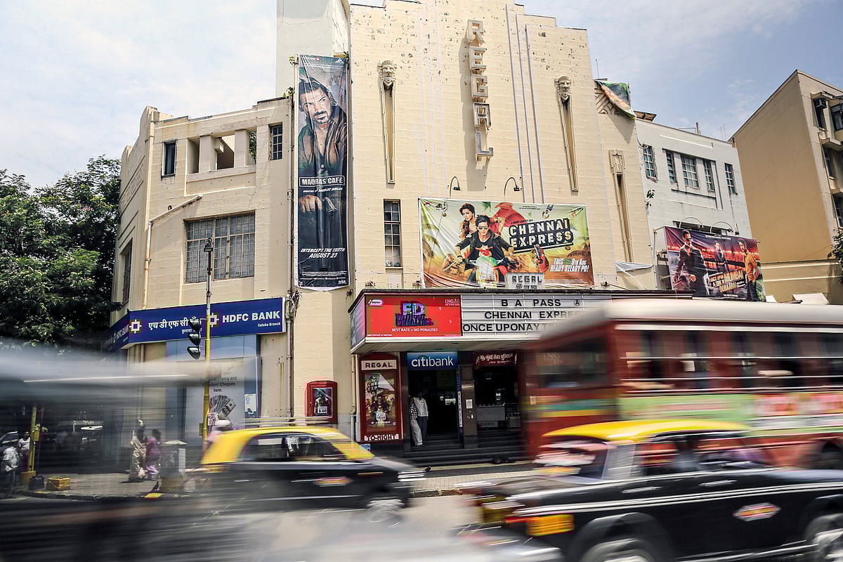 Traffic passes the Regal Cinema in the Colaba area of Mumbai, India. (Photographer: Dhiraj Singh/Bloomberg)