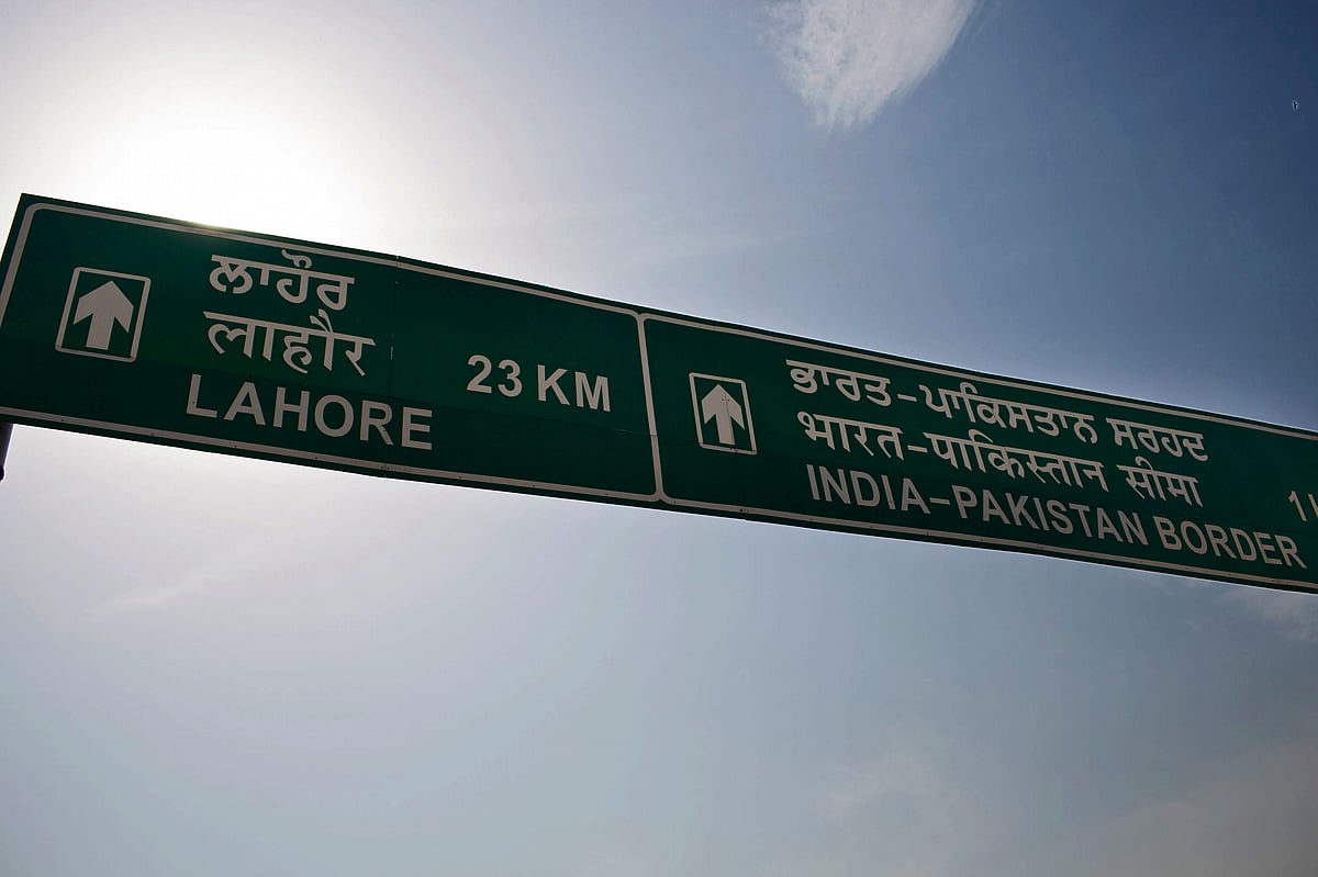 A road sign for the India-Pakistan border stands in Attari, India. (Photographer: Brent Lewin/Bloomberg)