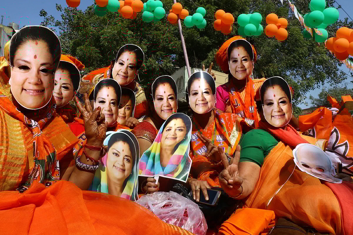 BJP supporters wear masks of Rajasthan Chief Minister Vasundhara Raje in Ajmer, on Dec. 5, 2018. (Photograph: PTI)