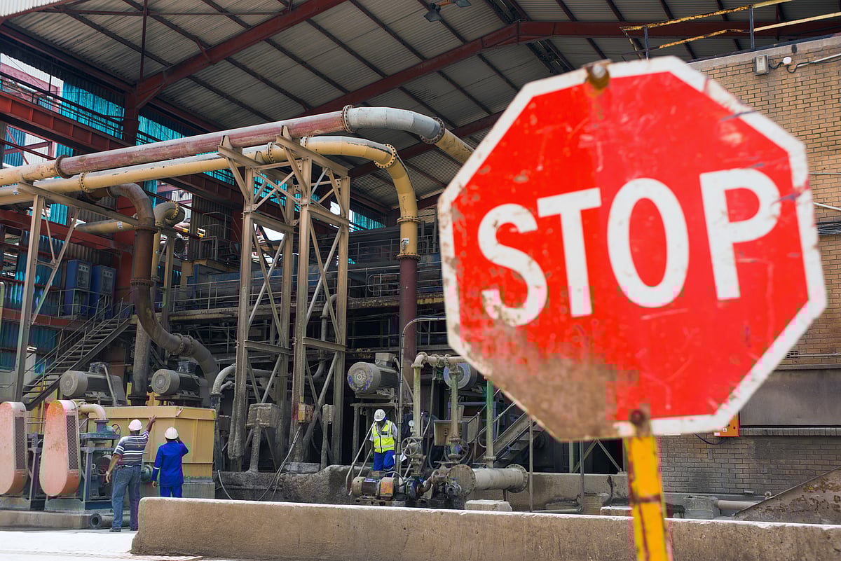 A stop sign at a metal plant. (Photographer: Waldo Swiegers/Bloomberg)