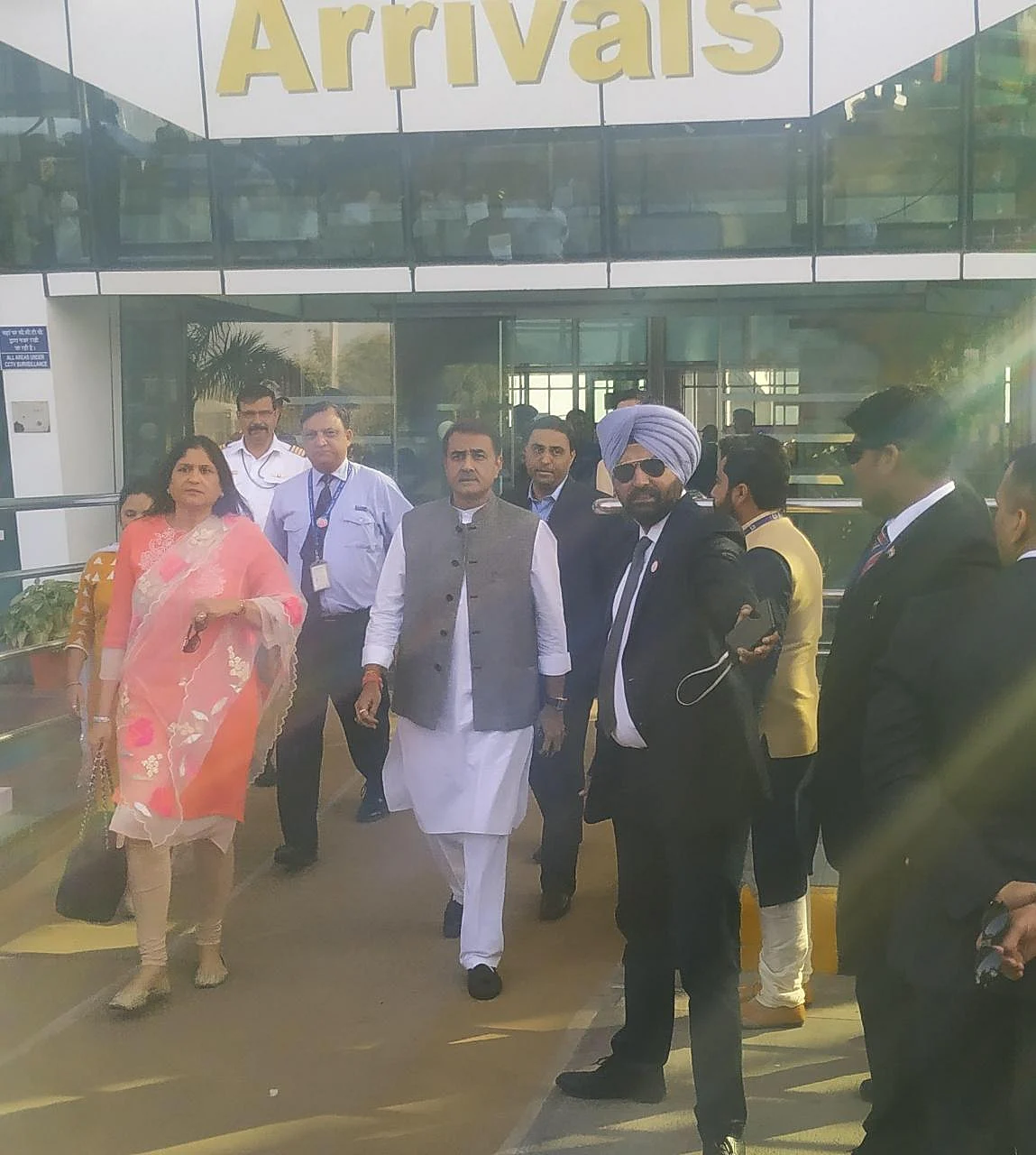 Former union minister Praful Patel arrives at the Udaipur Airport with his wife. (Source: Reliance Industries) 