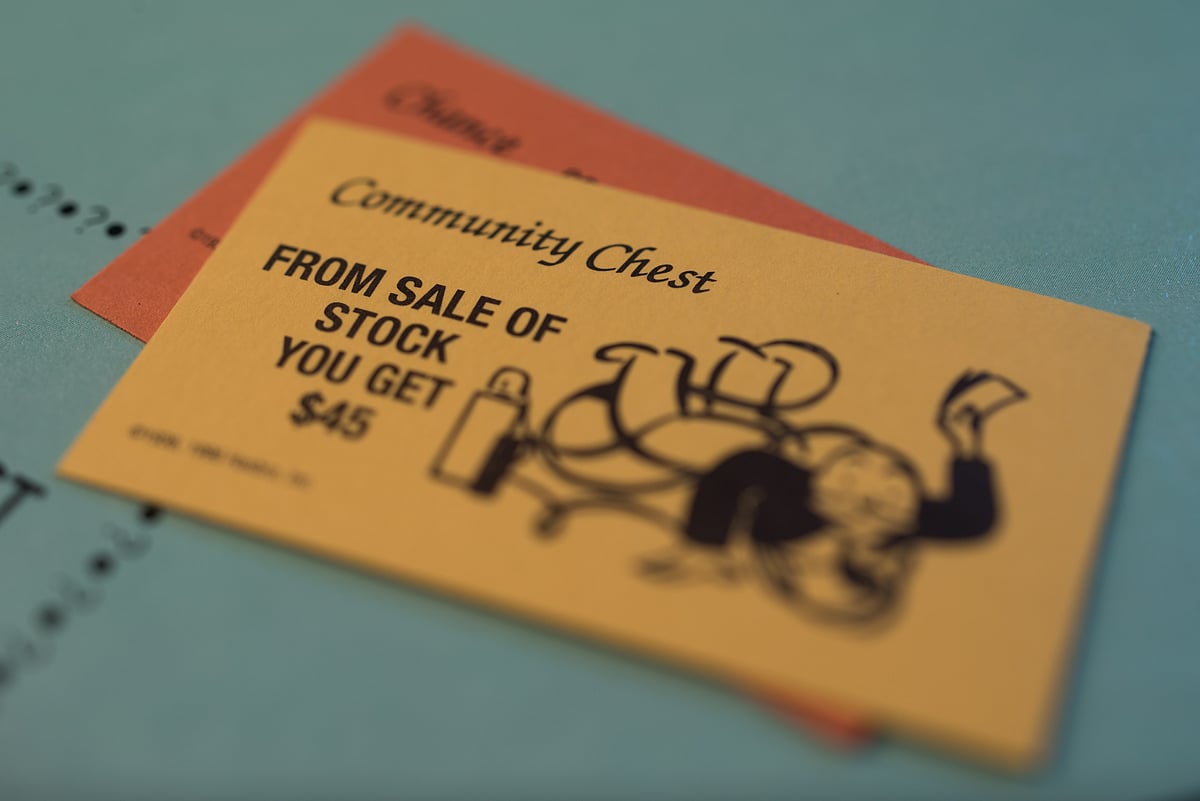 A “From Sale Of Stock” Community Chest card is arranged on a Hasbro Inc. Monopoly board game. (Photographer: Ron Antonelli/Bloomberg)
