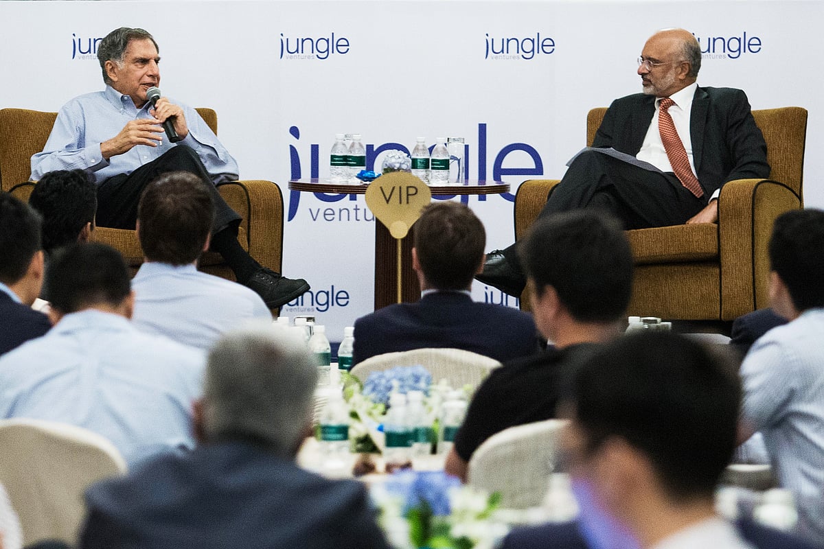 Ratan Tata speaks as Piyush Gupta of  DBS Group listens during a session advising startups. (Photographer: Nicky Loh/Bloomberg)