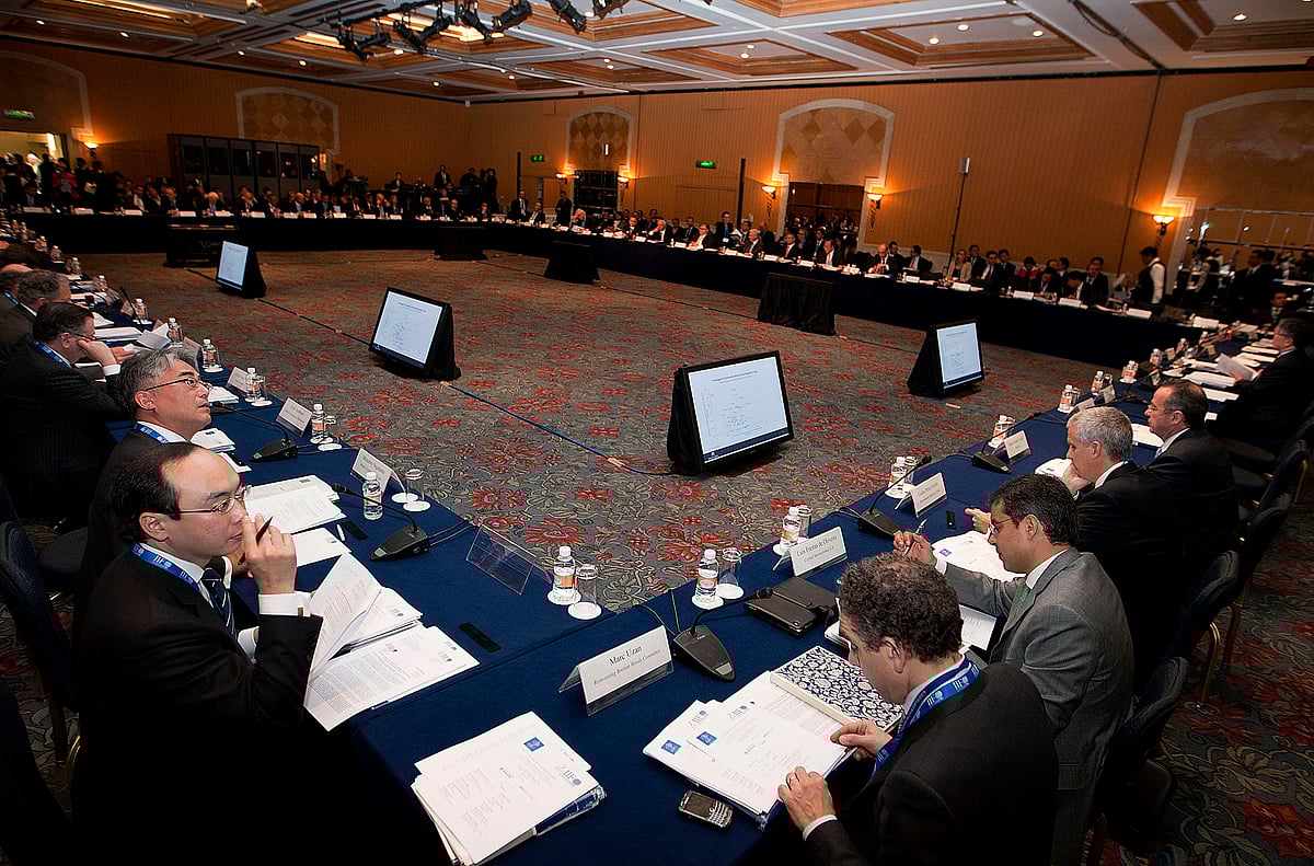 Attendees listen during an event ahead of the Group of 20 finance ministers in Mexico City, on Feb. 24, 2012.&nbsp; (Photographer: Susana Gonzalez/Bloomberg).