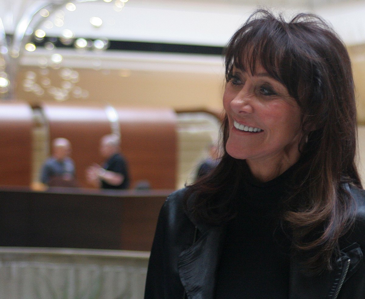 Diane Hendricks, chief executive officer of ABC Supply Co., smiles during a company meeting at a hotel in Rosemont, Illinois, U.S. (Photographer: John McCormick/Bloomberg)