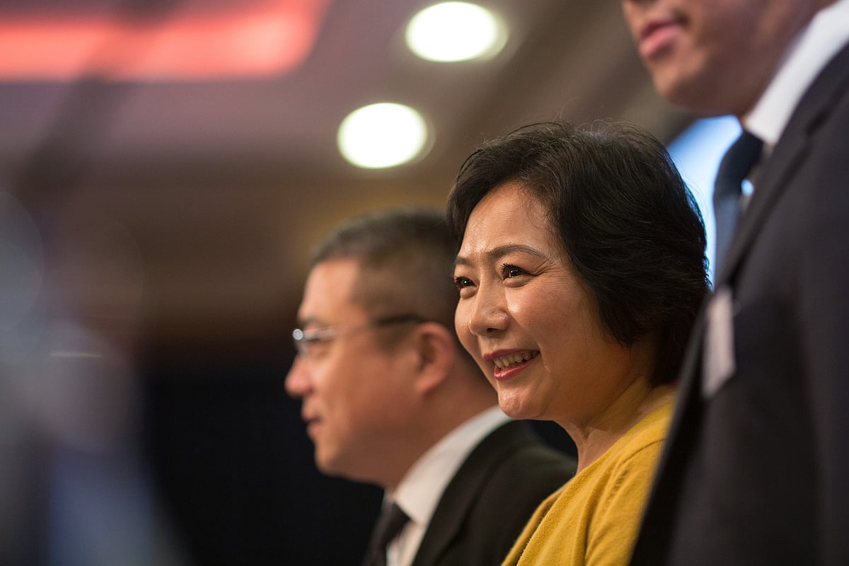 Billionaire Wu Yajun, chairman of Longfor Properties Co., reacts during a news conference in Hong Kong, China. (Photographer: Jerome Favre/Bloomberg)