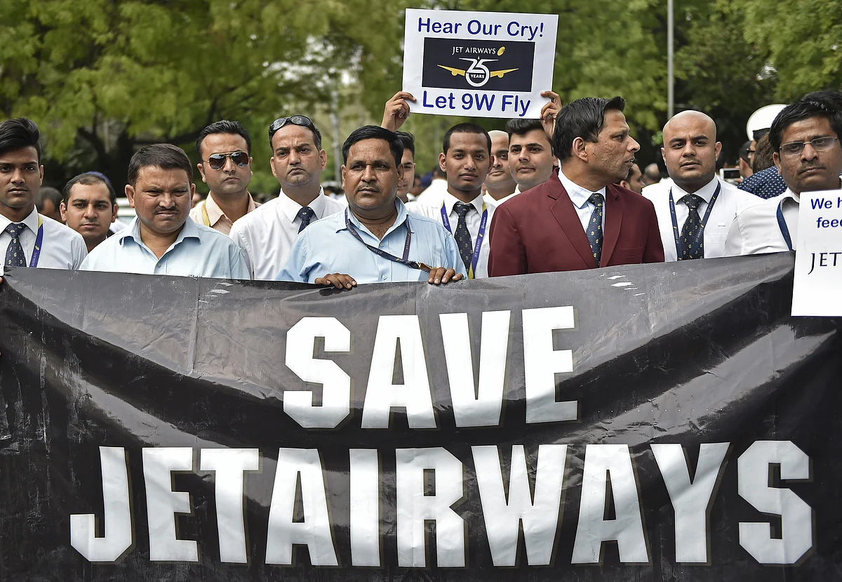 Cabin crew hold placards during a protest by Jet Airways employees at Jantar Mantar in Delhi, India (Photographer: Anindito Mukherjee/Bloomberg) 