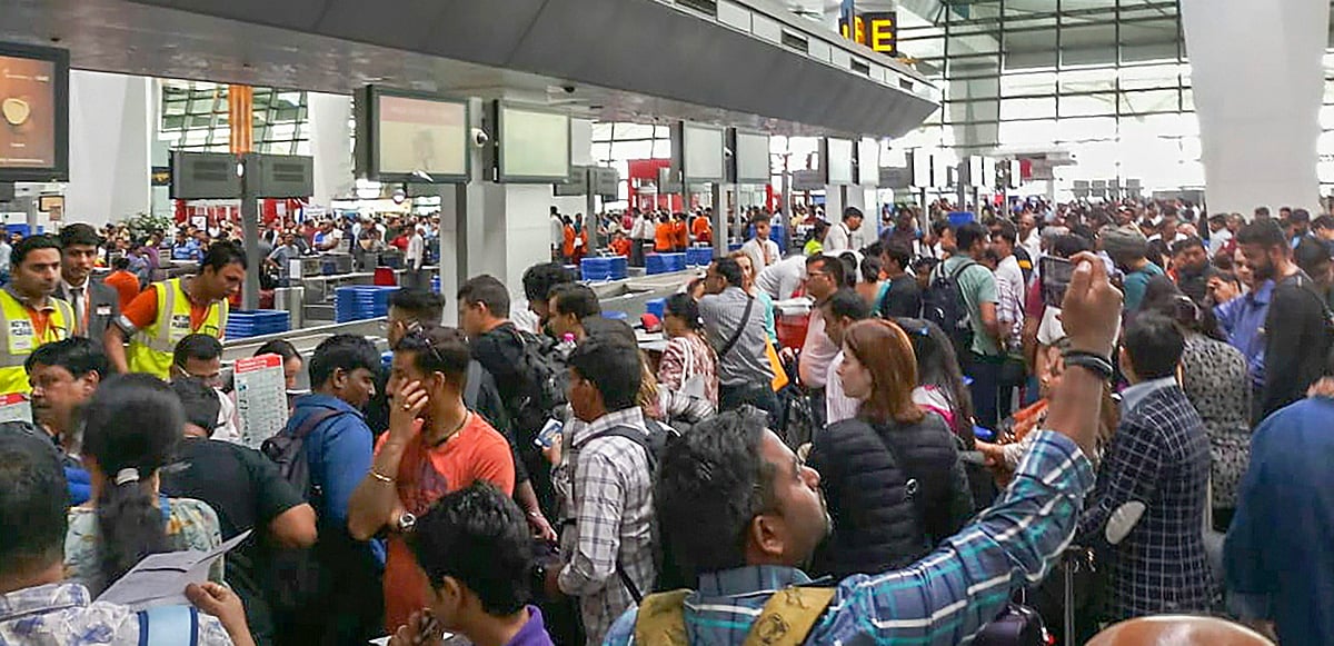 <div class="paragraphs"><p>File image of passengers stranded at the Indira Gandhi International Airport, in New Delhi. (Source:  PTI)</p></div>