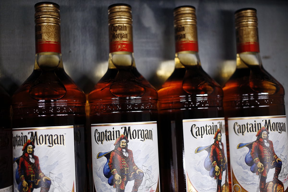 Bottles of Diageo Plc Captain Morgan brand rum sit in the warehouse in Louisville, Kentucky, U.S. (Photographer: Luke Sharrett/Bloomberg)