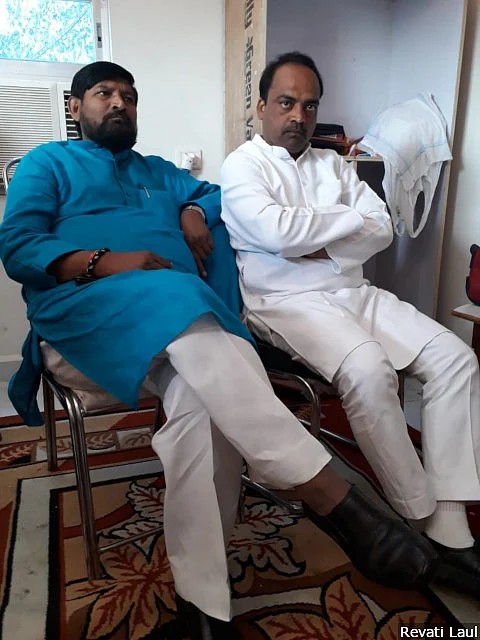 Ramesh Chand Bind (right), the Bharatiya Janata Party candidate from Bhadohi, is surrounded by party workers--including legislator Dinanath Bhaskar (left). Following a politically embarrassing speech, he is watched and micro-managed.