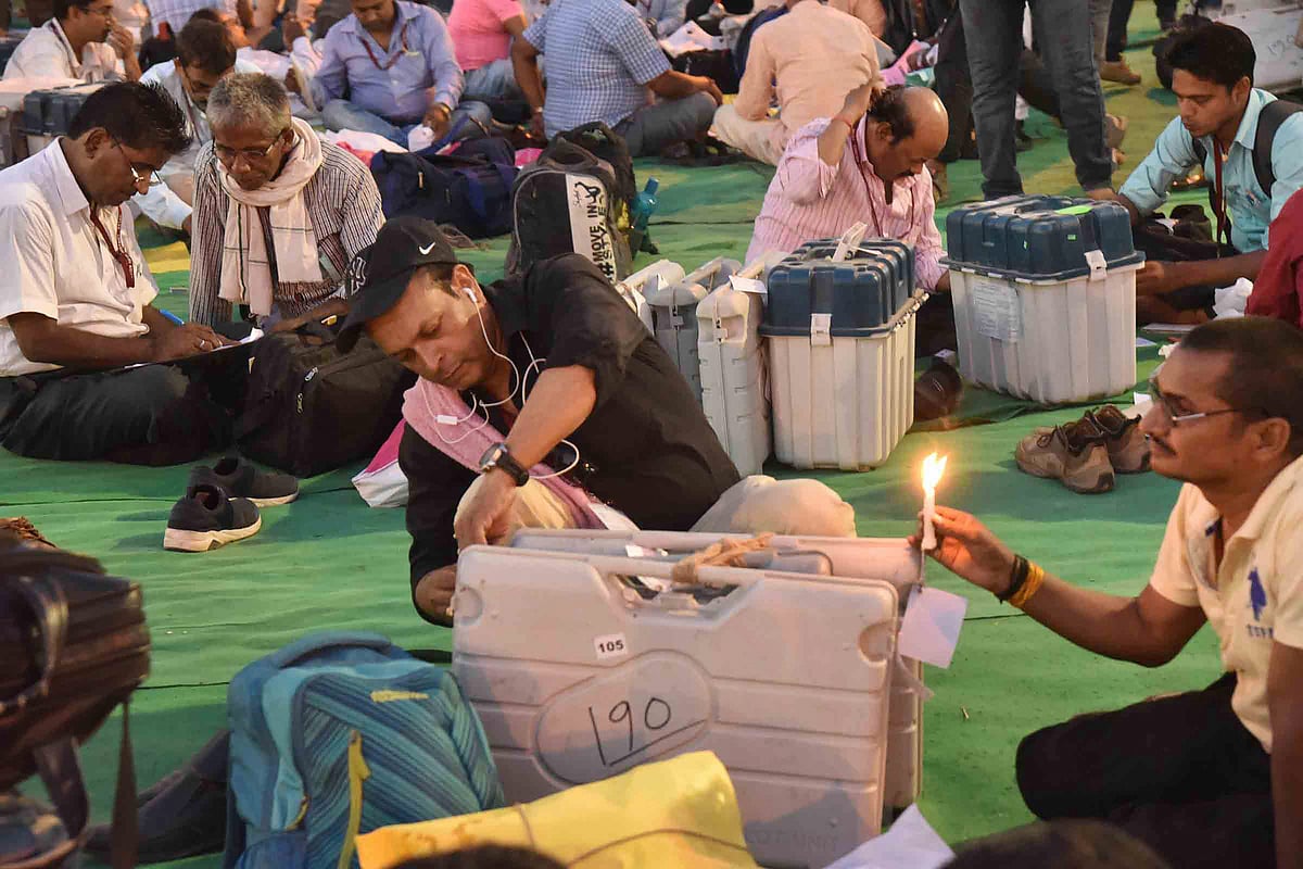<div class="paragraphs"><p>The Election Commission of India scheduled the counting of votes in Bihar on Friday, Nov. 14. File image of polling officials sealing the EVMs and VVPAT machines. (Source: PTI)</p></div>