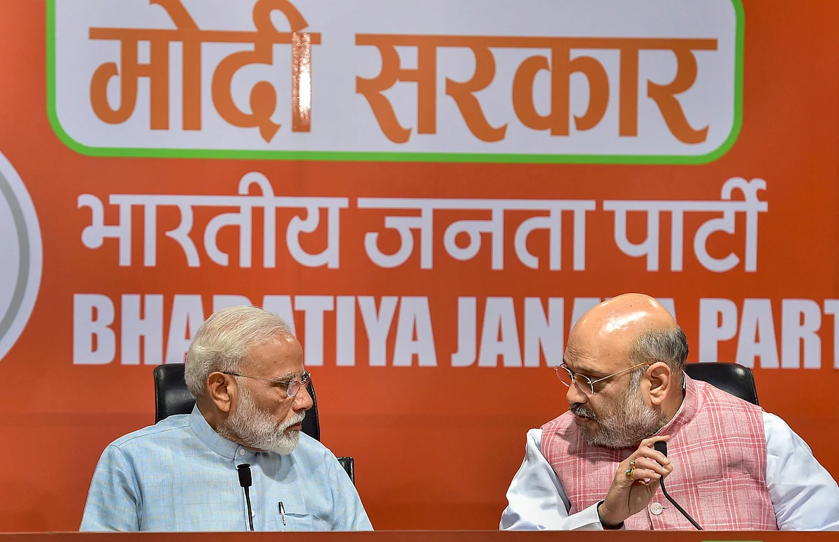 Prime Minister Narendra Modi with BJP President Amit Shah during a press conference at the party headquarter in New Delhi (Source: PTI)