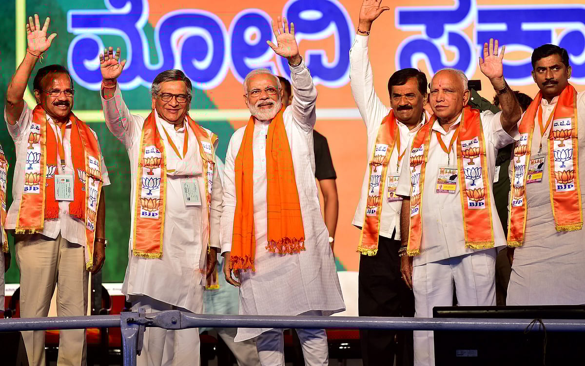 Former Congress Union Minister and now BJP leader SM Krishna, with Prime Minister Narendra Modi, at Bengaluru on April 13, 2019. (Photograph: PTI)