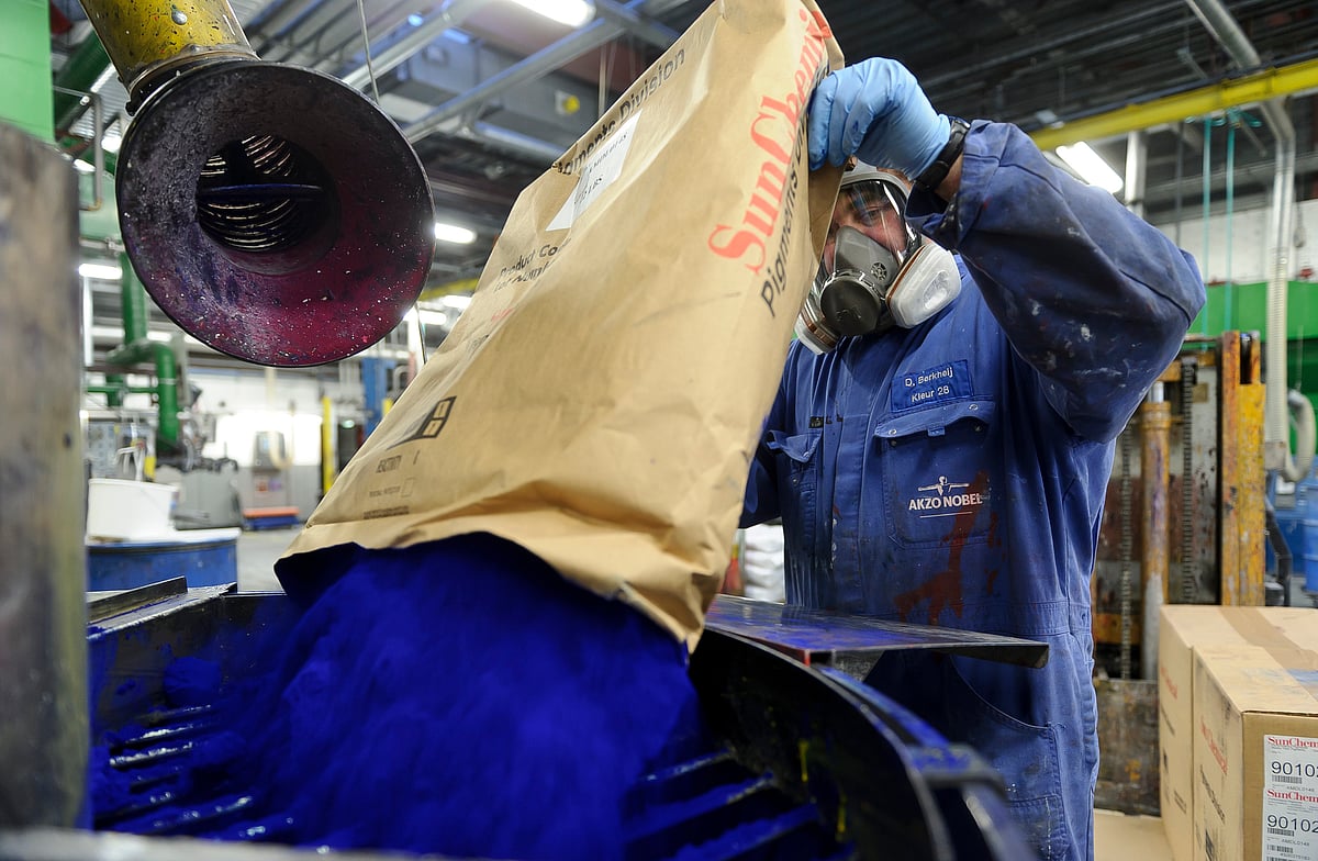<div class="paragraphs"><p>An employee adds blue pigment to a new batch of paint at the Akzo Nobel NV production facility. (Photographer: Jock Fistick/Bloomberg)</p></div>