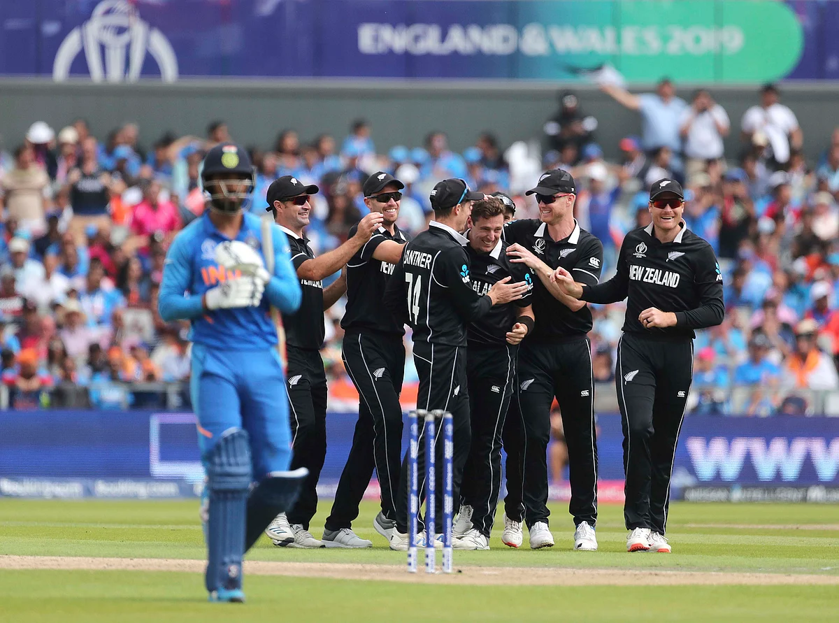 Matt Henry celebrates a wicket with teammates during the Cricket World Cup semi-final between India and New Zealand, in Manchester, on July 10, 2019. (Photograph: AP/PTI)