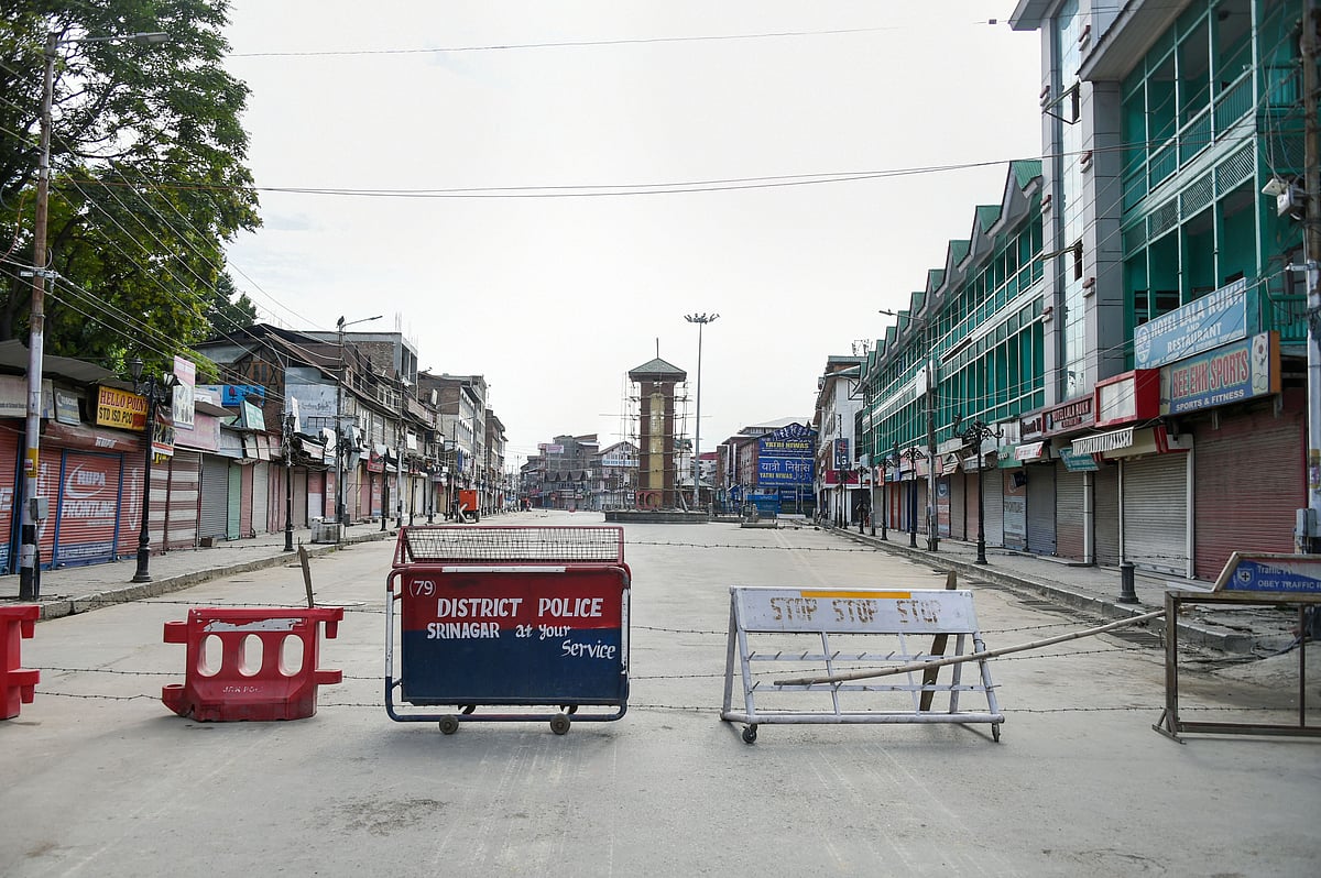 A view of a deserted street during restrictions at Lal Chowk in Srinagar. (Source: PTI)
