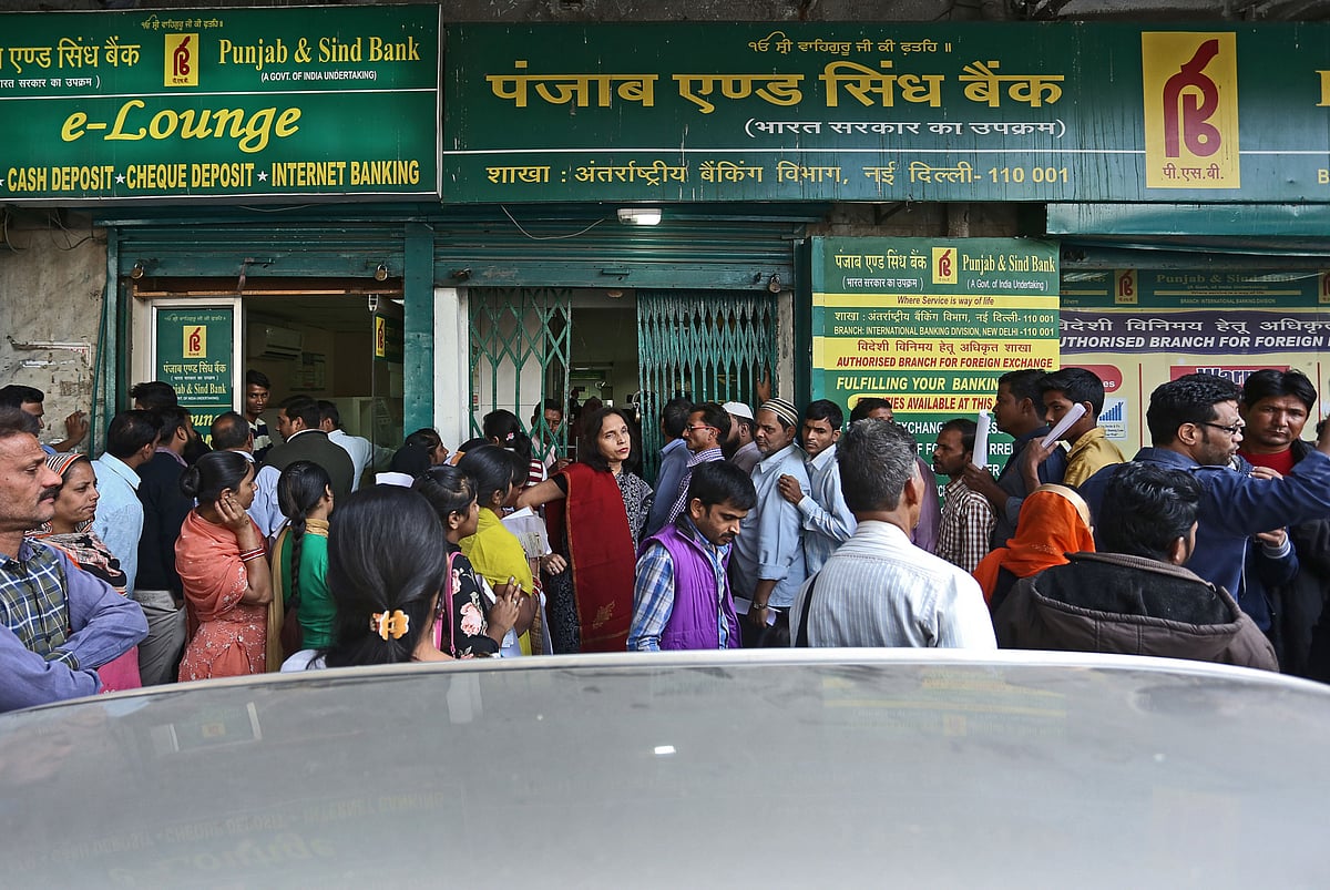 A Punjab &amp; Sind Bank branch in New Delhi. (Photographer: Anindito Mukherjee/Bloomberg)