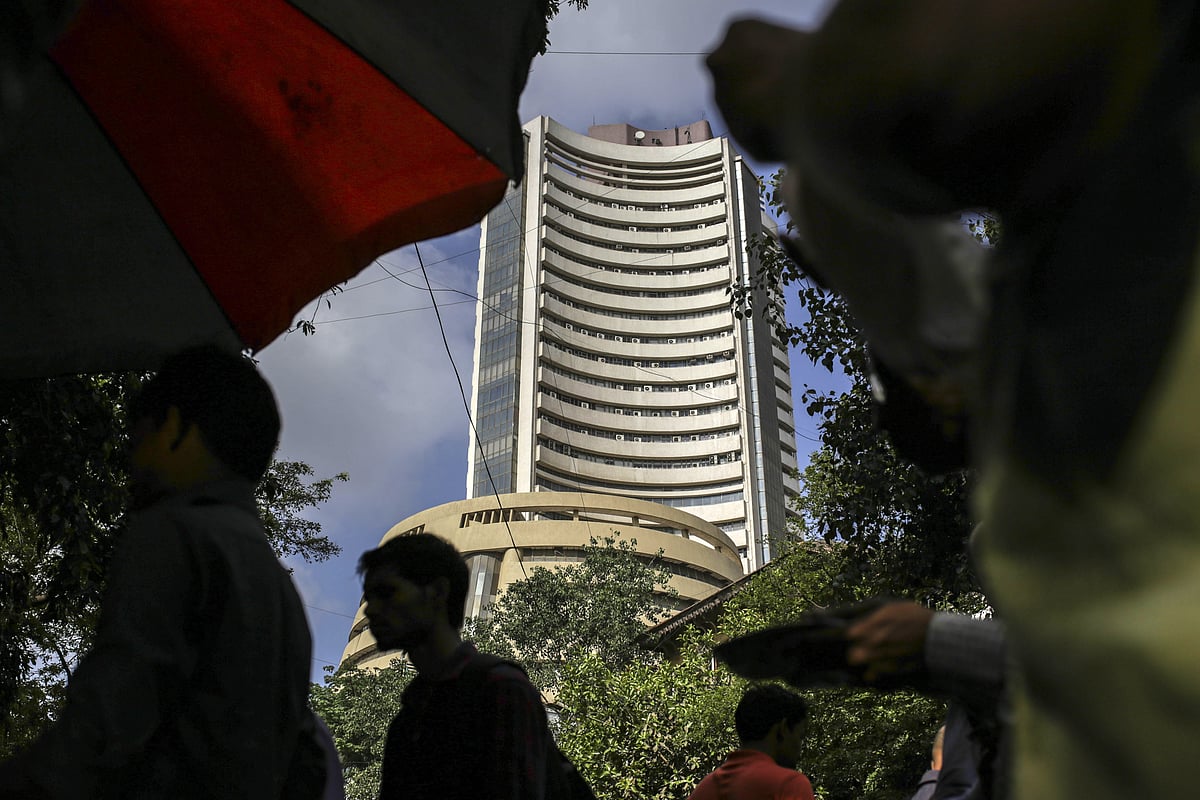 Pedestrians walk past the Bombay Stock Exchange (BSE) building in Mumbai, India. (Photographer: Dhiraj Singh/Bloomberg)