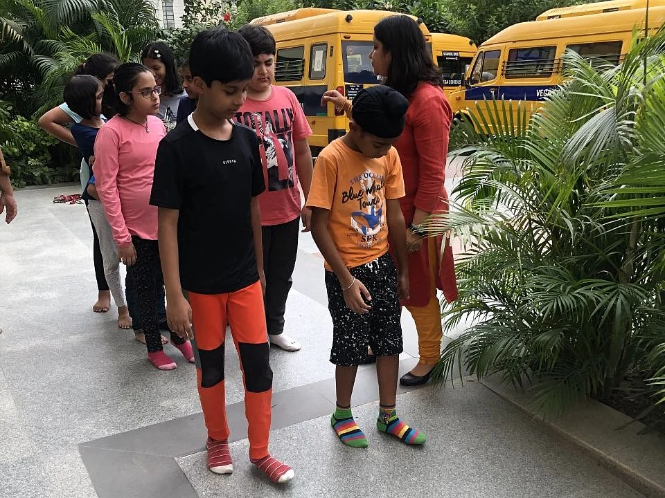 These are young children learning how to conduct a Blind Walk. (Photo: Esha)