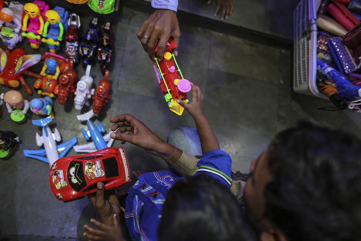 A customer browses toys at a store in Mumbai. (Photographer: Dhiraj Singh/Bloomberg)