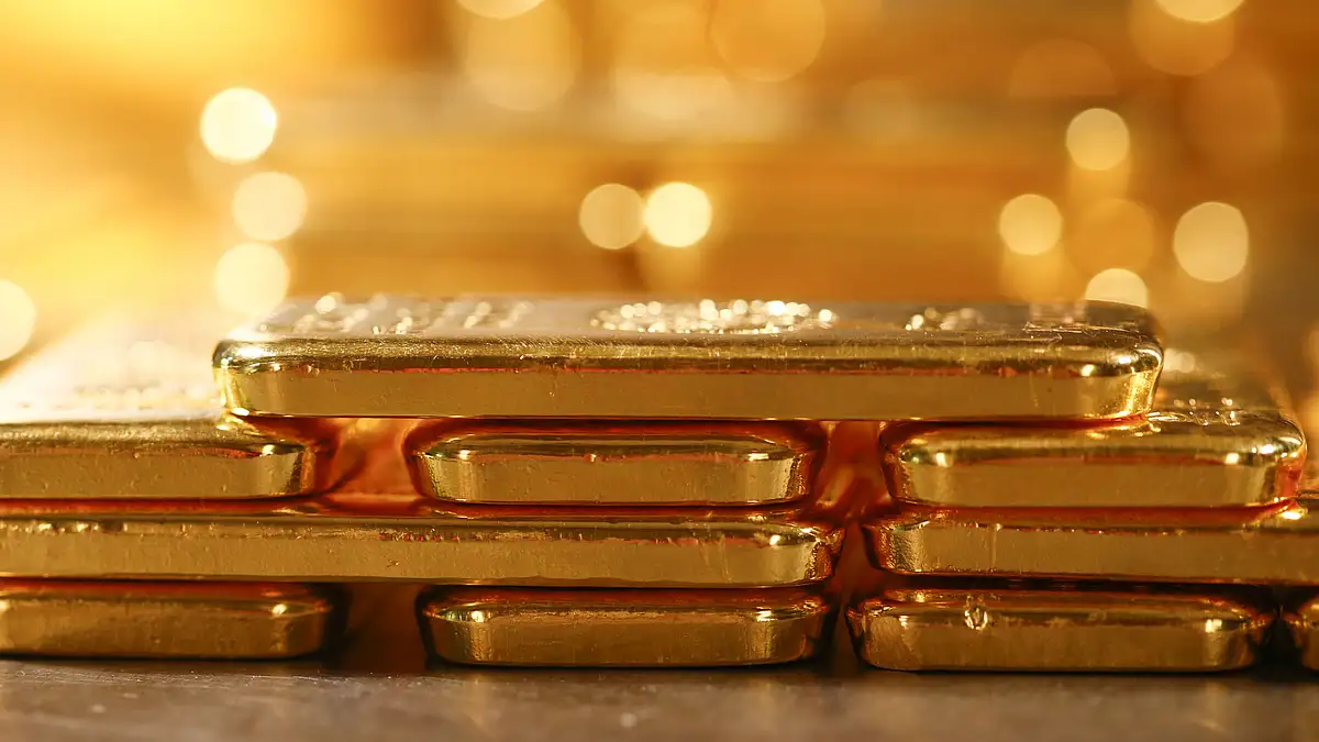 A stack of one kilogram gold bullion bars sit inside a vault in Germany. (Photographer: Michaela Handrek-Rehle/Bloomberg)