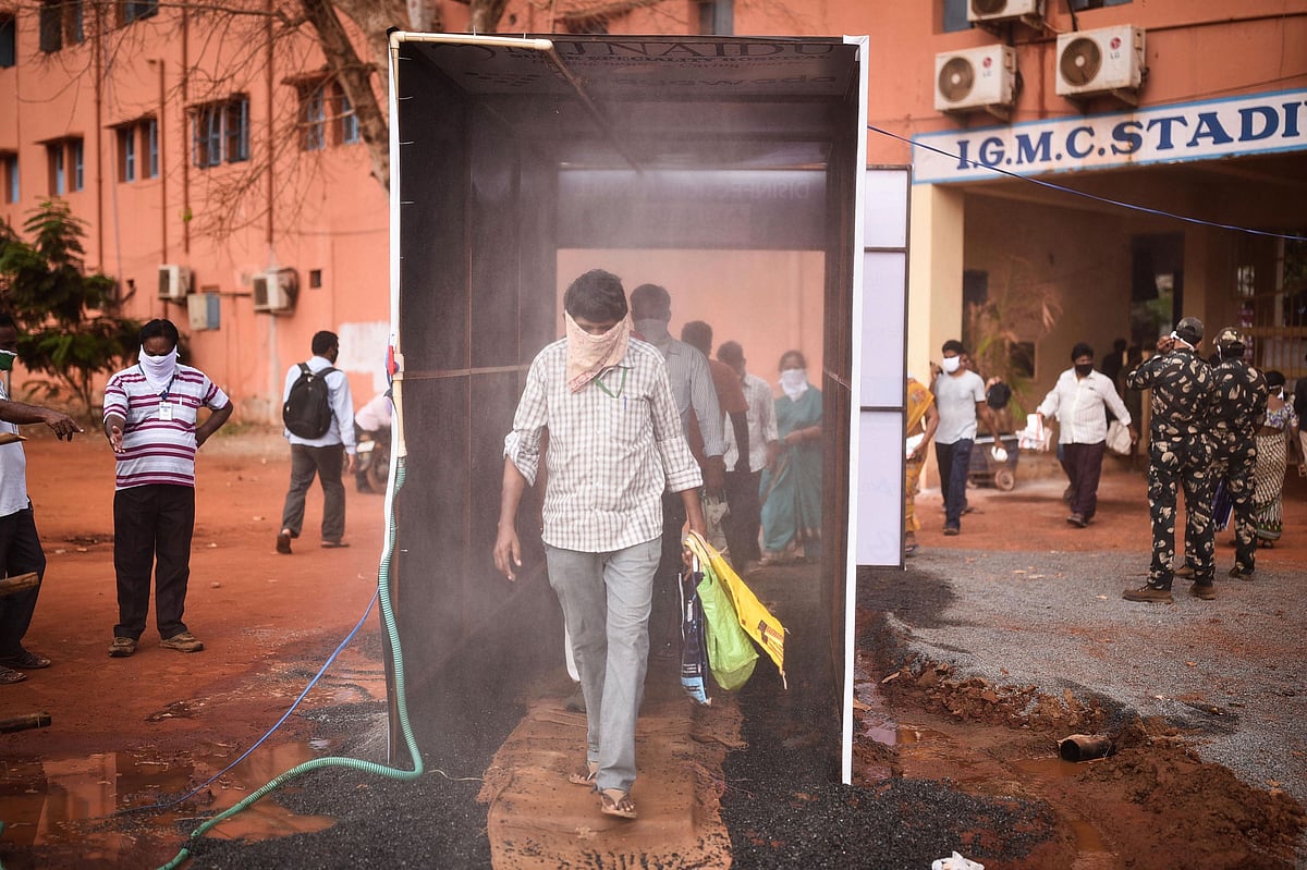 A man passes through a disinfection tunnel, in Vijayawada, on April 8, 2020. (Photograph: PTI)