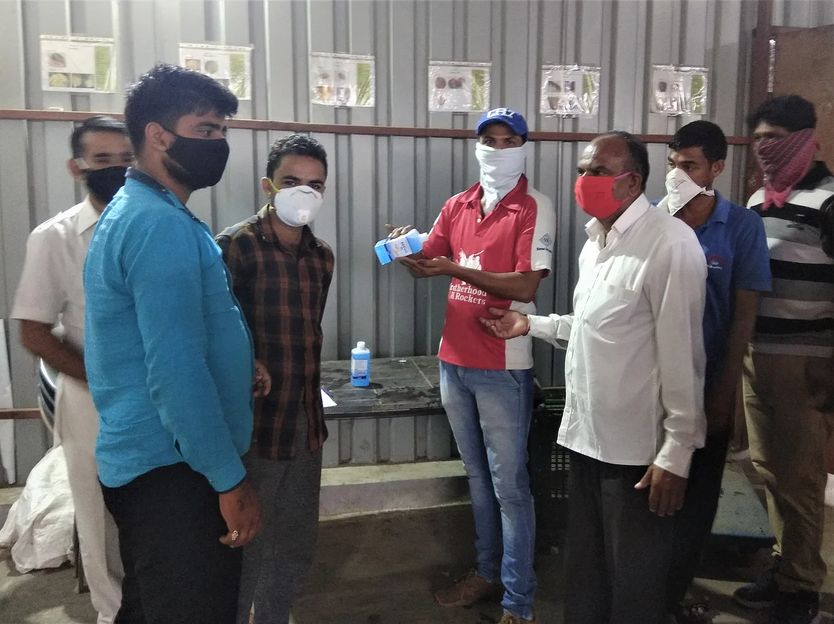 Farmpal’s workers sanitise their hands while wearing face masks. (Source: Fampal)