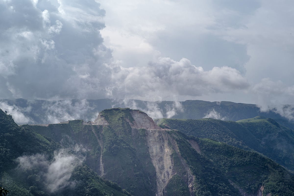 Clouds cover a limestone quarry in East Khasi Hills in Meghalaya. (Photographer: Sanjit Das/Bloomberg)