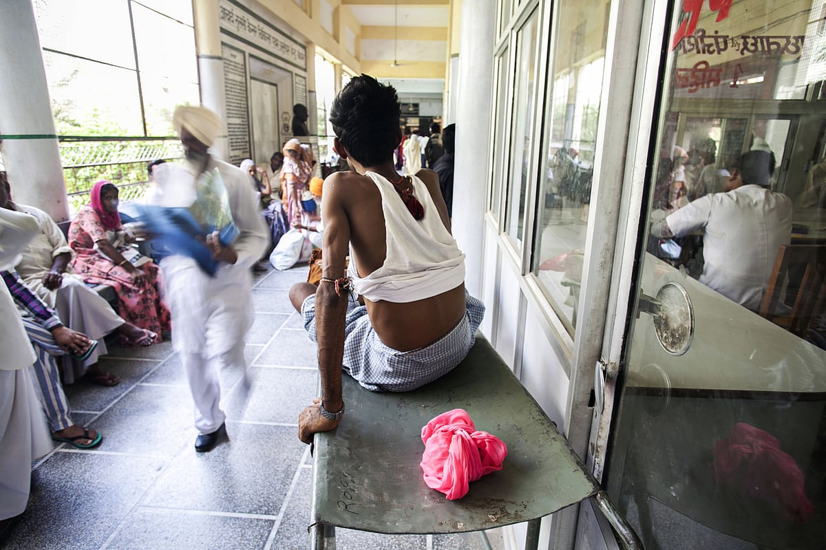 Patients wait for treatment in the corridor of a hospital in Bikaner, Rajasthan. (Photographer: Prashanth Vishwanathan/Bloomberg)