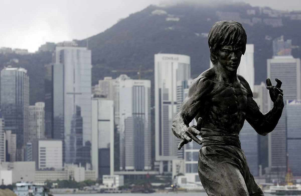 A statue of late martial arts movie star Bruce Lee is displayed along the Avenue of Stars in Hong Kong, China. (Photographer: Jerome Favre/Bloomberg News)
