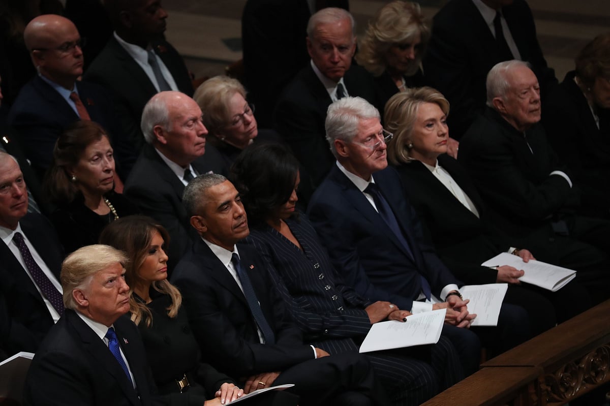 U.S. Presidents Donald Trump, Barack Obama, Bill Clinton and Jimmy Carter, with First Ladies Melania Trump, Michelle Obama, and former Secretary of State Hillary Clinton. on Dec. 5, 2018. (Photographer: Andrew Harrer/Bloomberg)