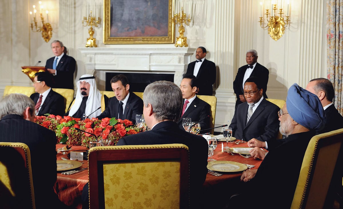 Prime Minister Manmohan Singh and other G20 leaders listen to U.S. President George Bush in an meeting called to address the global financial crisis, at the White House in Washington D.C., on Nov. 14, 2008. (Photograph: PIB)