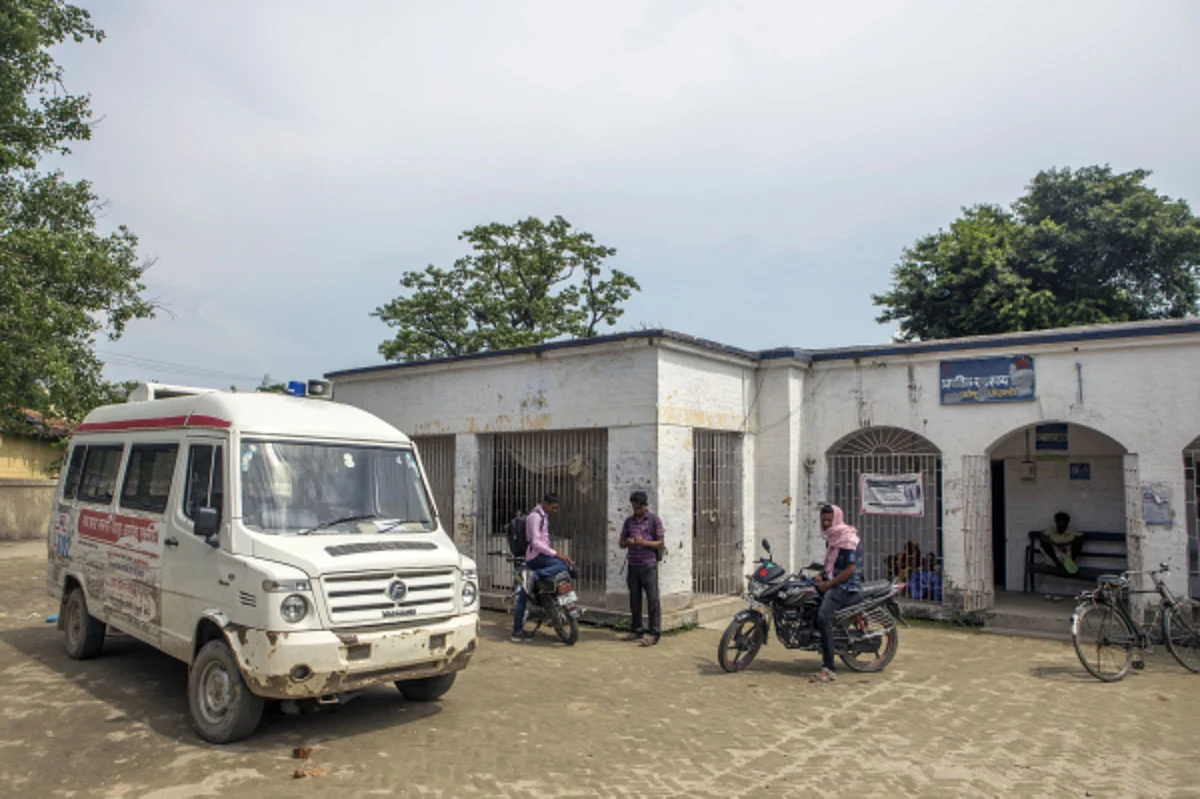 An ambulance stands outside the Primary Health Care Center in Raghopur, Bihar. (Photographer: Prashanth Vishwanathan/Bloomberg)