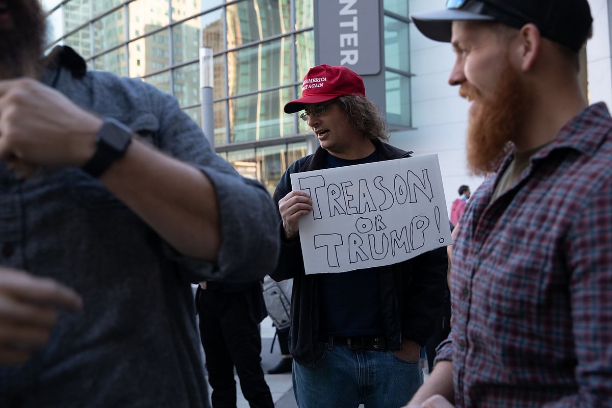 A demonstrator holds a sign at a protest during the 2020 U.S. Presidential election, in Detroit, Michigan, on Nov. 4, 2020. (Photographer: Emily Elconin/Bloomberg)