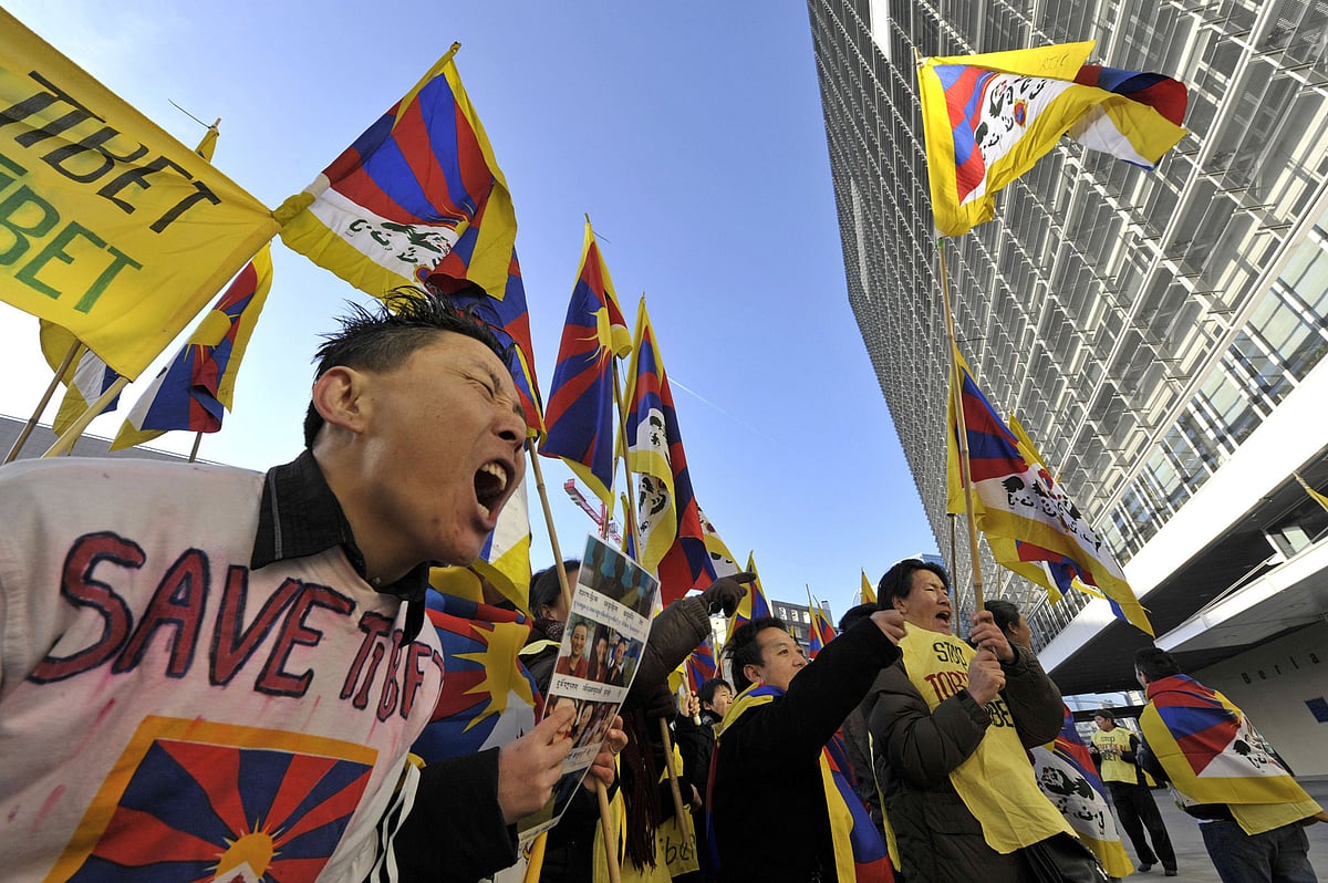 A group of demonstrators protest against China’s Tibet policy outside the European Commission headquarters, in Brussels, Belgium. (Photographer: Jock Fistick/Bloomberg News)