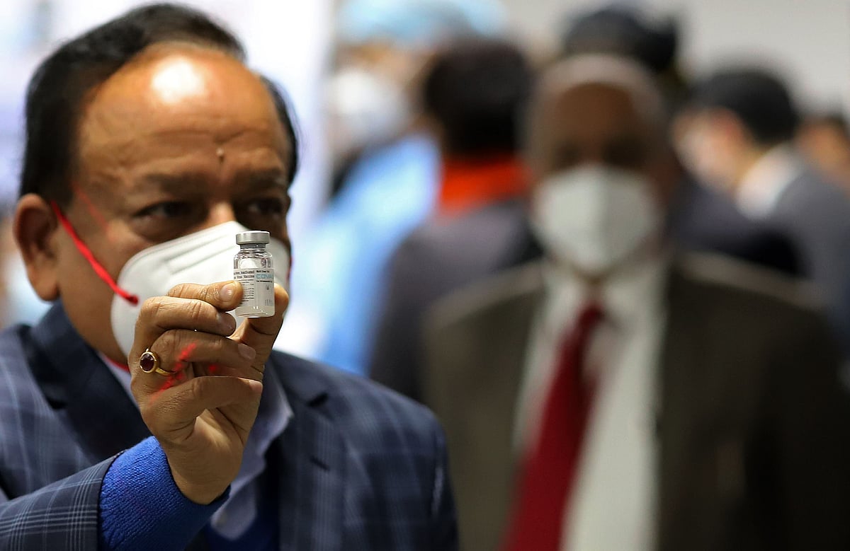 Harsh Vardhan, India’s health minister, displays a vial of Covaxin at AIIMS in New Delhi, on Jan. 16, 2021. (Photographer: Anindito Mukherjee/Bloomberg)
