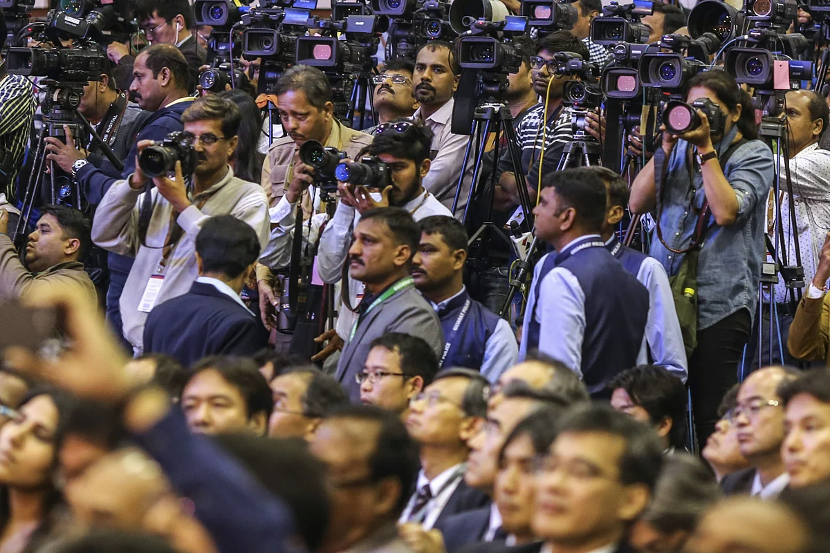 Members of the media attend an event. (Photographer: Dhiraj Singh/Bloomberg)