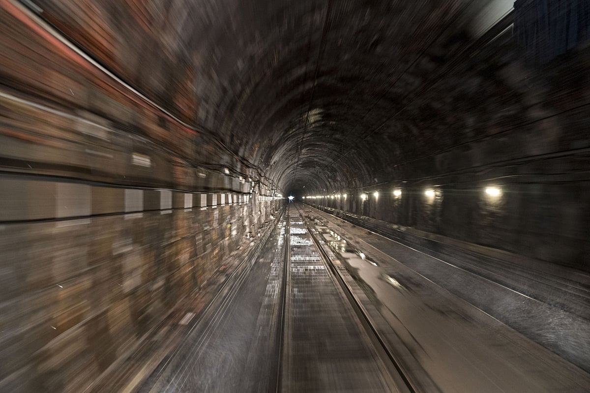 Train tracks run through a section of of a tunnel. (Photographer: Andrew Harrer/Bloomberg)