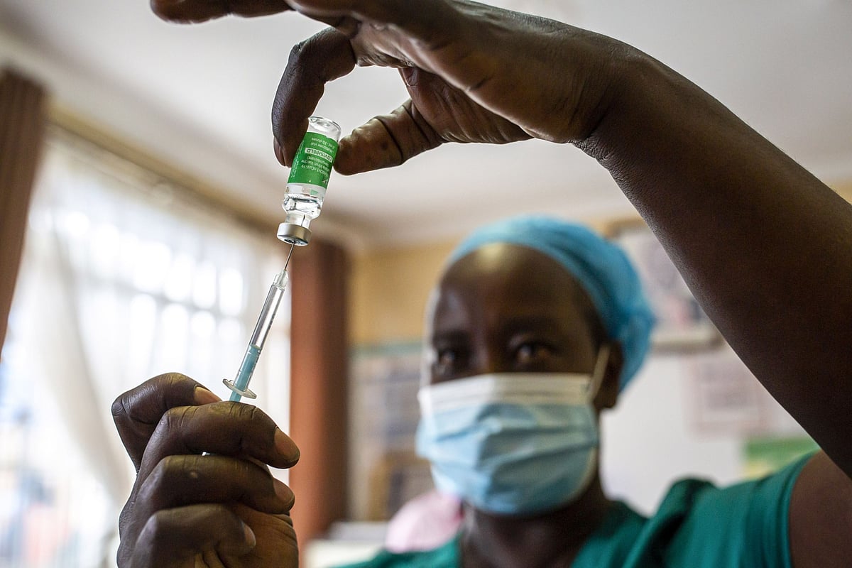 A nurse prepares a dose of the Covishield Covid-19 vaccine manufactured by Serum Institute of India, in Thika, Kenya, on March 30, 2021. (Photographer: Patrick Meinhardt/Bloomberg)