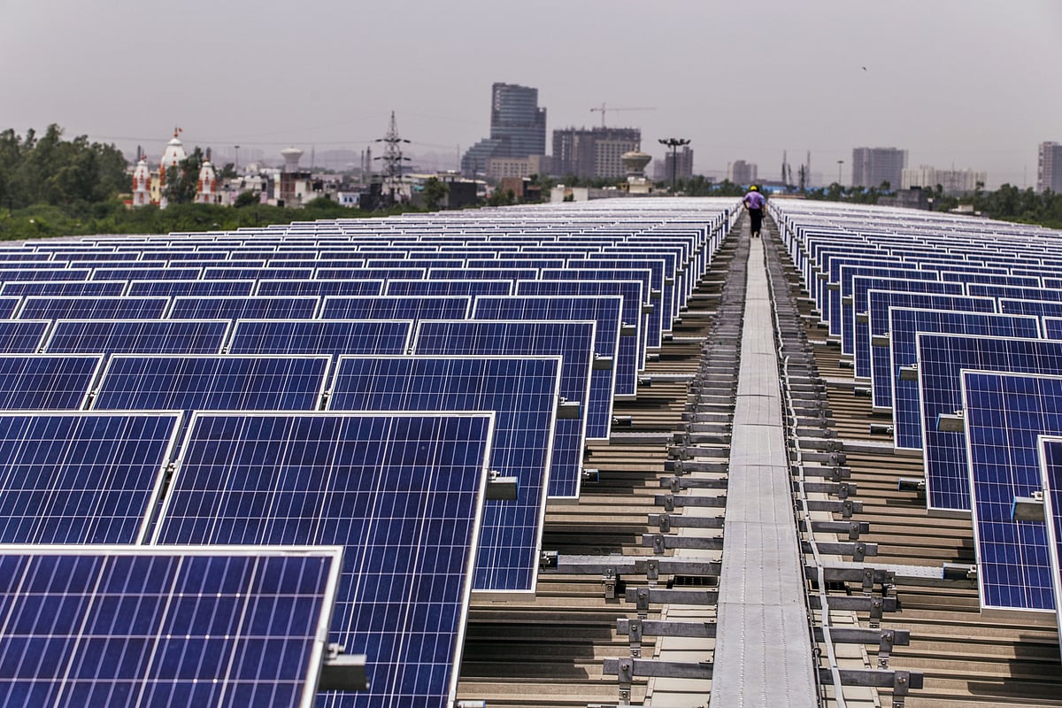 Solar panels stand on a roof in Surajpur, Uttar Pradesh. (Photographer: Prashanth Vishwanathan/Bloomberg)