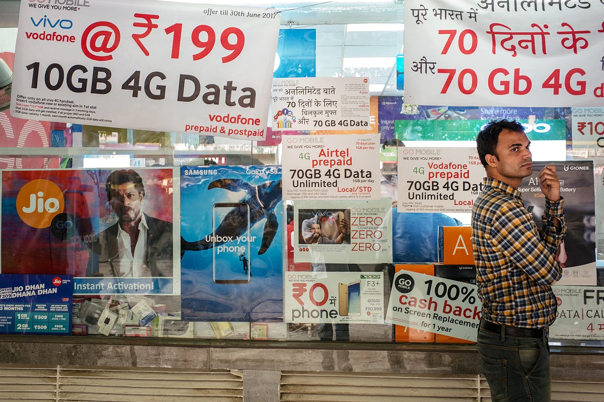 <div class="paragraphs"><p>Posters of various mobile networks at the Nehru Place IT Market in New Delhi. (Photographer: Sanjit Das/Bloomberg)</p></div>