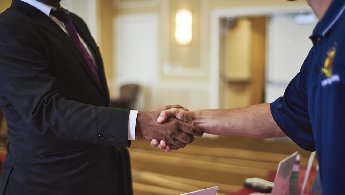<div class="paragraphs"><p>Two people shake hands. (Photographer: Gabby Jones/Bloomberg)</p></div>