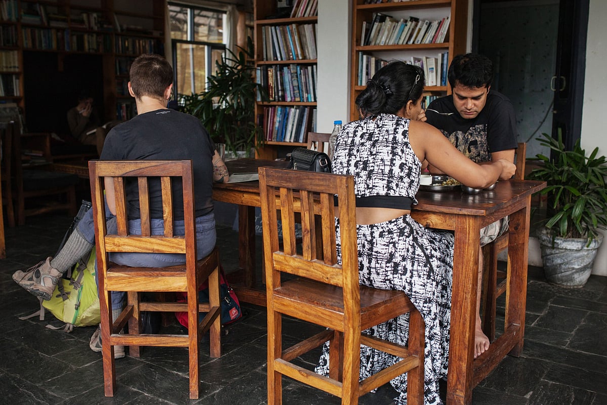 <div class="paragraphs"><p>Tourists and other customers sit in a cafe in the McLeod Ganj area of Dharamsala. (Photographer: Sara Hylton/Bloomberg)</p></div>