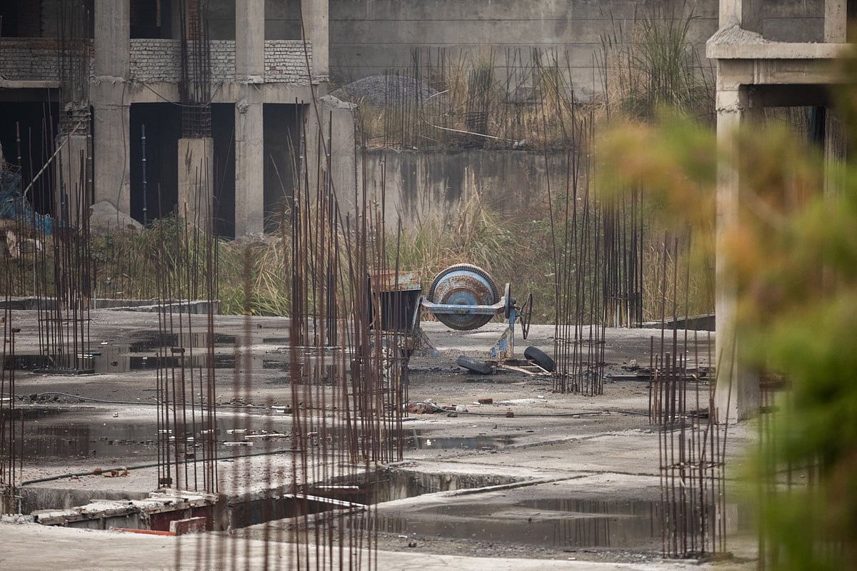 <div class="paragraphs"><p>A cement mixer stands at an abandoned construction site in a property development in Noida, Uttar Pradesh, on Jan. 20, 2020. (Photographer: Prashanth Vishwanathan/Bloomberg)</p></div>