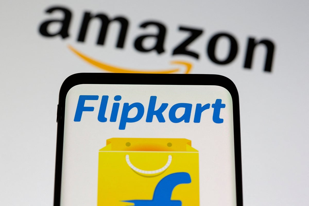 <div class="paragraphs"><p>Smartphone with Flipkart logo is seen in front of displayed Amazon logo. (Photo: Dado Ruvic/Reuters)</p></div>