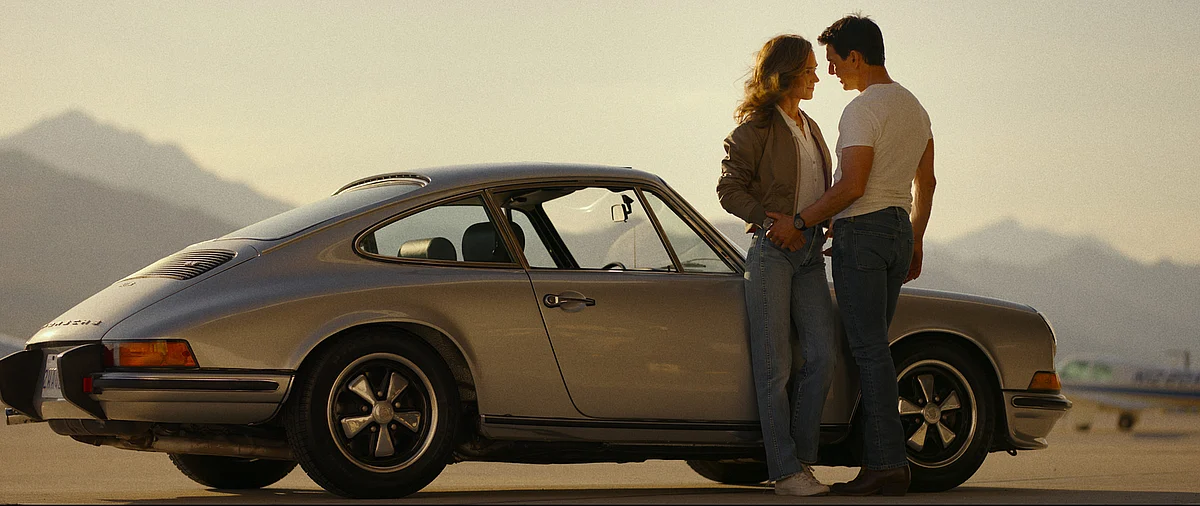 Jennifer Connelly, Tom Cruise, and the 1973 Porsche 911 in “Top Gun: Maverick.”Photographer: Paramount Pictures
