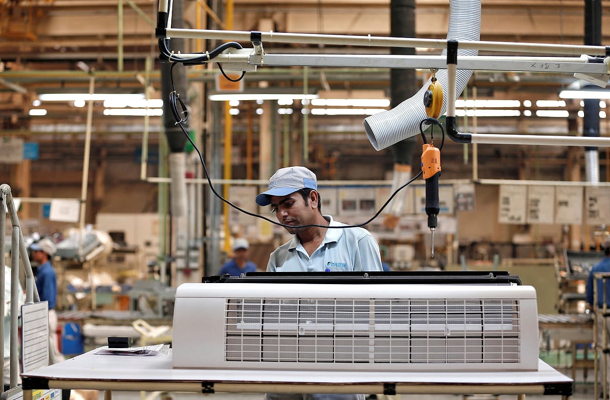 <div class="paragraphs"><p>A worker assembles an air conditioner inside a plant in India. (Photo:&nbsp;Adnan Abidi/Reuters)</p></div>