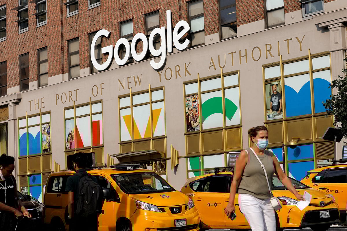 <div class="paragraphs"><p>A person in a mask walks by the New York Google offices in New York City. (Photo: Andrew Kelly/Reuters)</p></div>