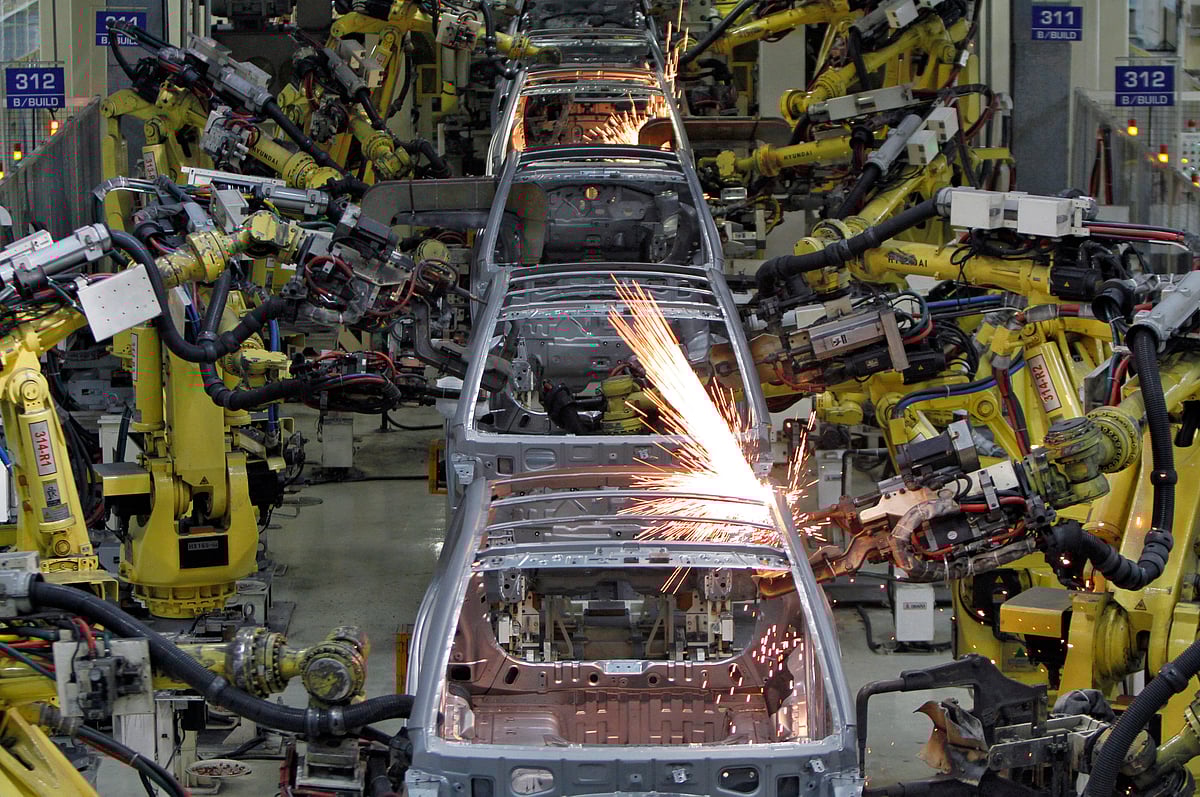 <div class="paragraphs"><p>Robot arms assemble cars inside the Hyundai Motor India plant at Kancheepuram, Tamil Nadu (Photograph: REUTERS/Babu)</p></div>