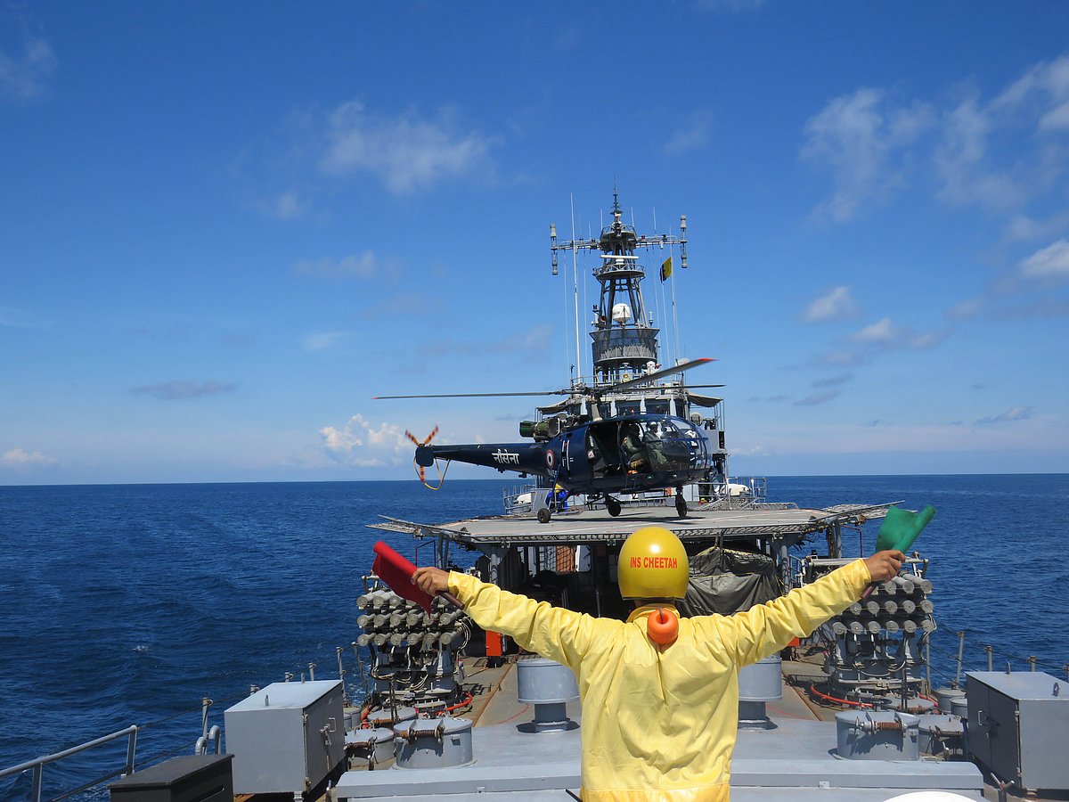 <div class="paragraphs"><p>A naval officer directs a helicopter landing on the INS Cheetah. (Photograph: PIB)</p></div>